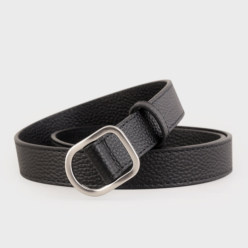 Black leather belt with a silver buckle on a light gray background