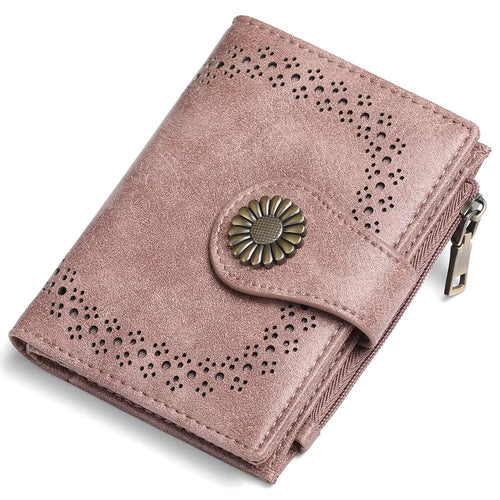Pink wallet with decorative button on a white background