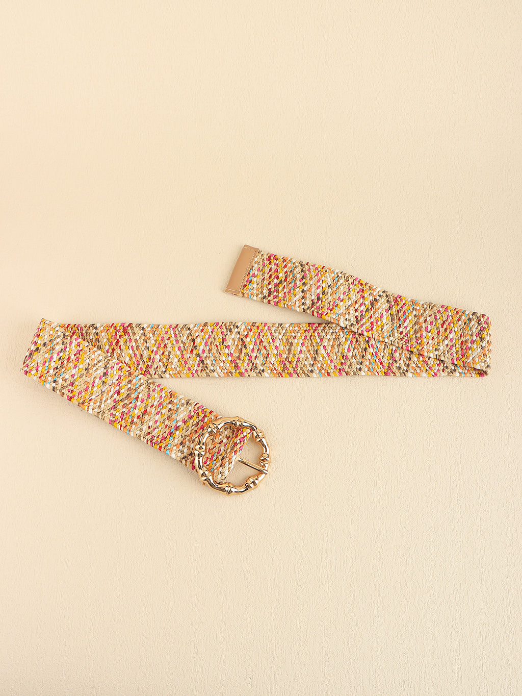 Multicolored belt with a gold buckle on a beige background