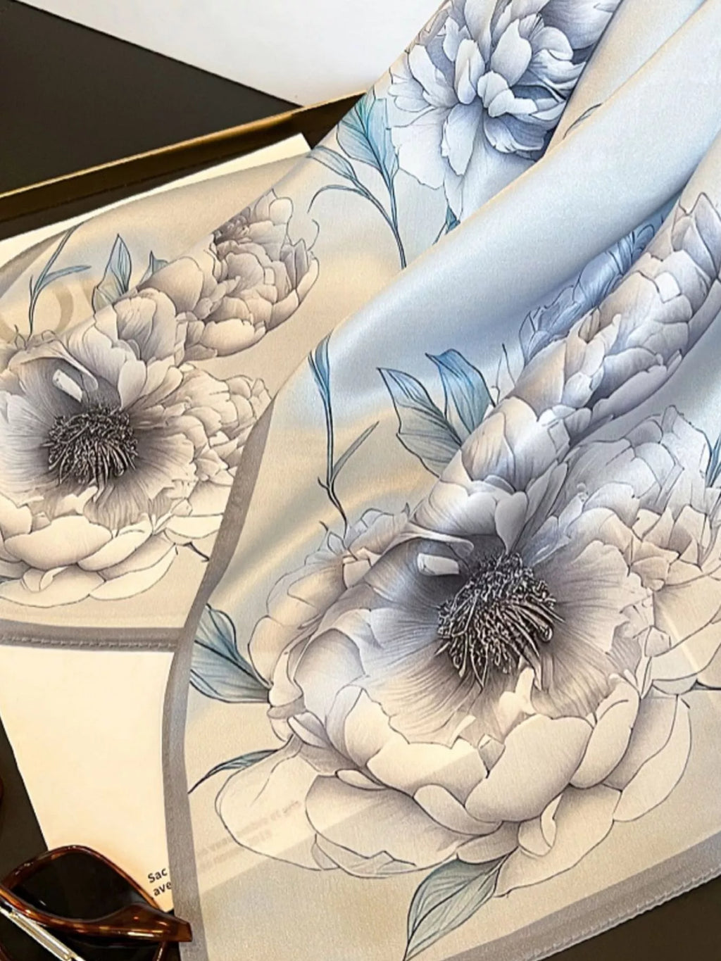 Close-up of a floral design with intricate details on a textured surface.