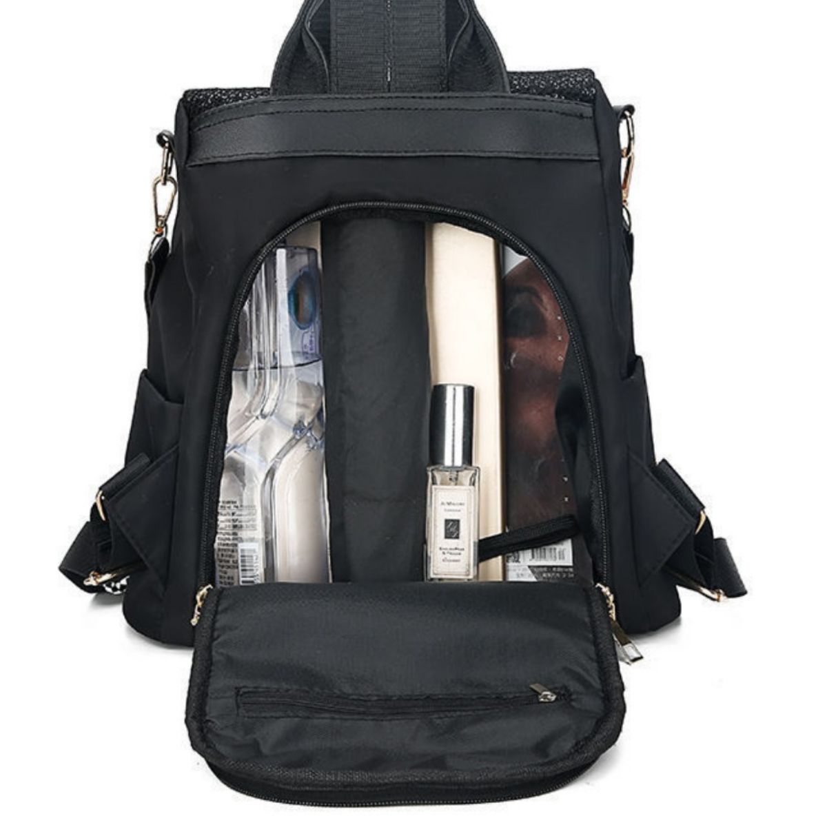 Black backpack with items like a bottle and a map inside on a white background