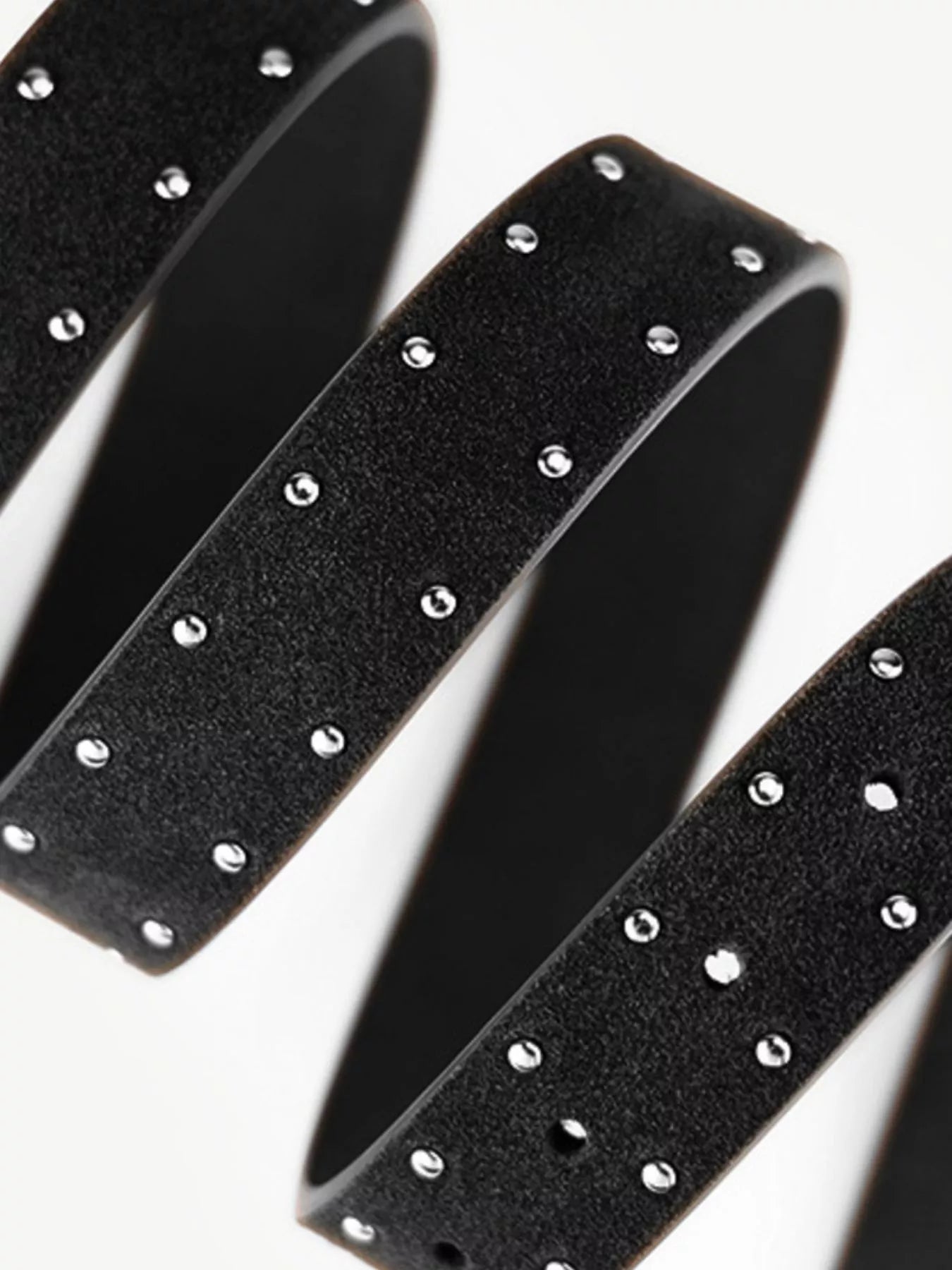 Black headbands with silver studs on a white background