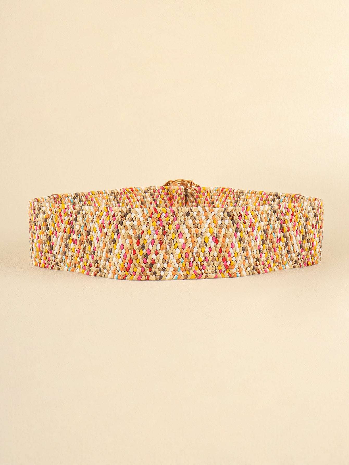Multicolored woven belt on a beige background