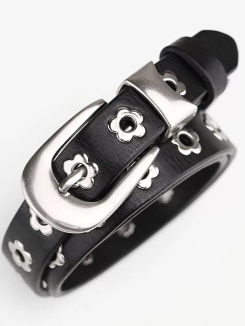 Black leather bracelet with silver buckle on a white background