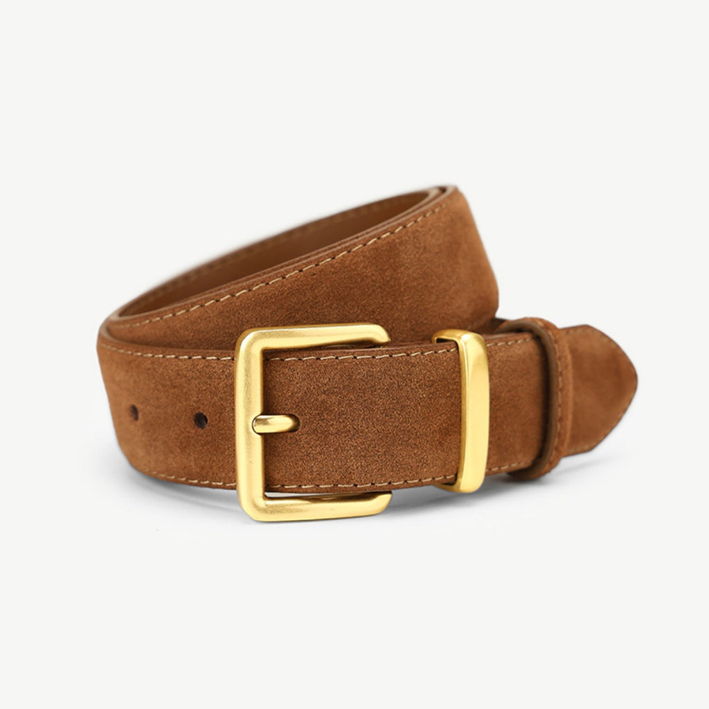 Brown leather belt with a gold buckle on a light gray background