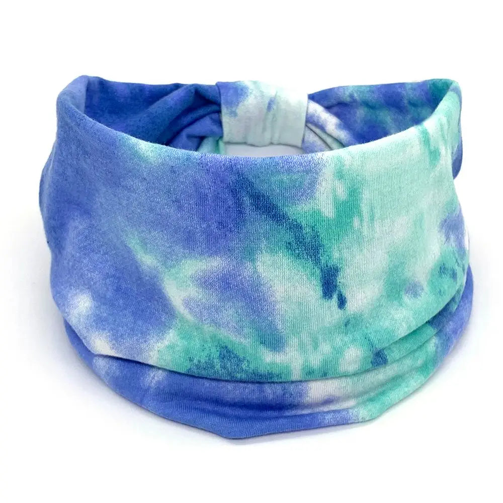 Tie-dye headband with blue and green pattern on a white background