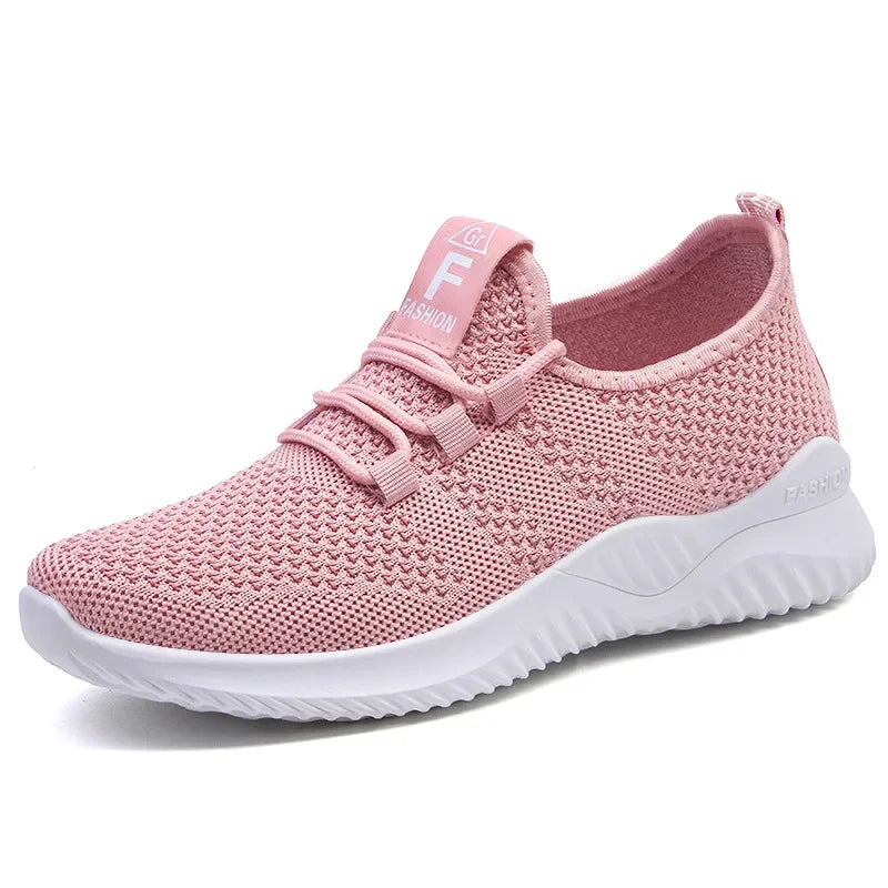 Pink sneaker with white sole on a white background