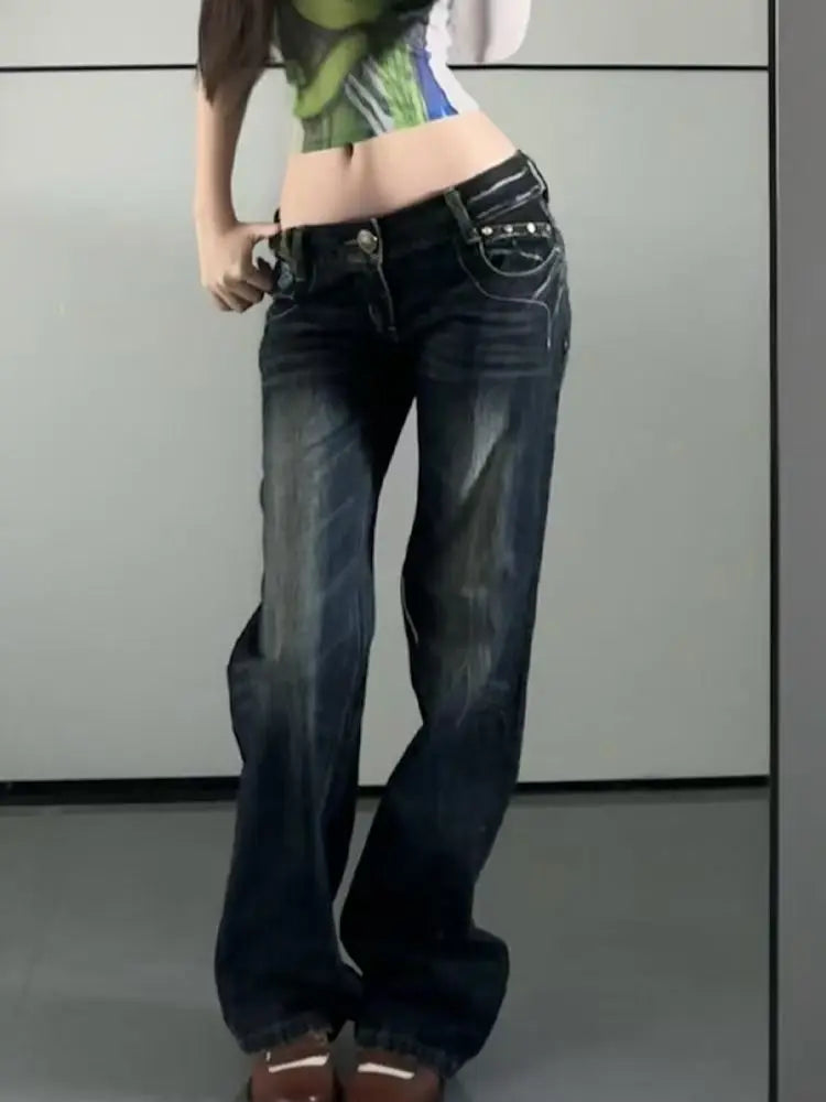 Model  wearing dark blue jeans with a plain background