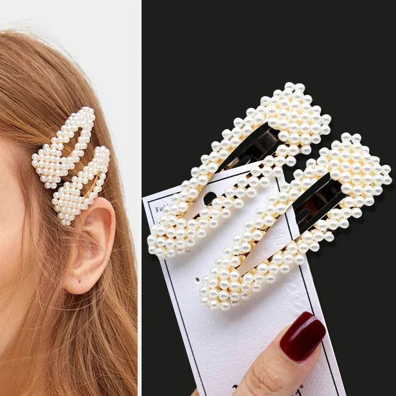 Pearl hair clip worn by a person and on a black background