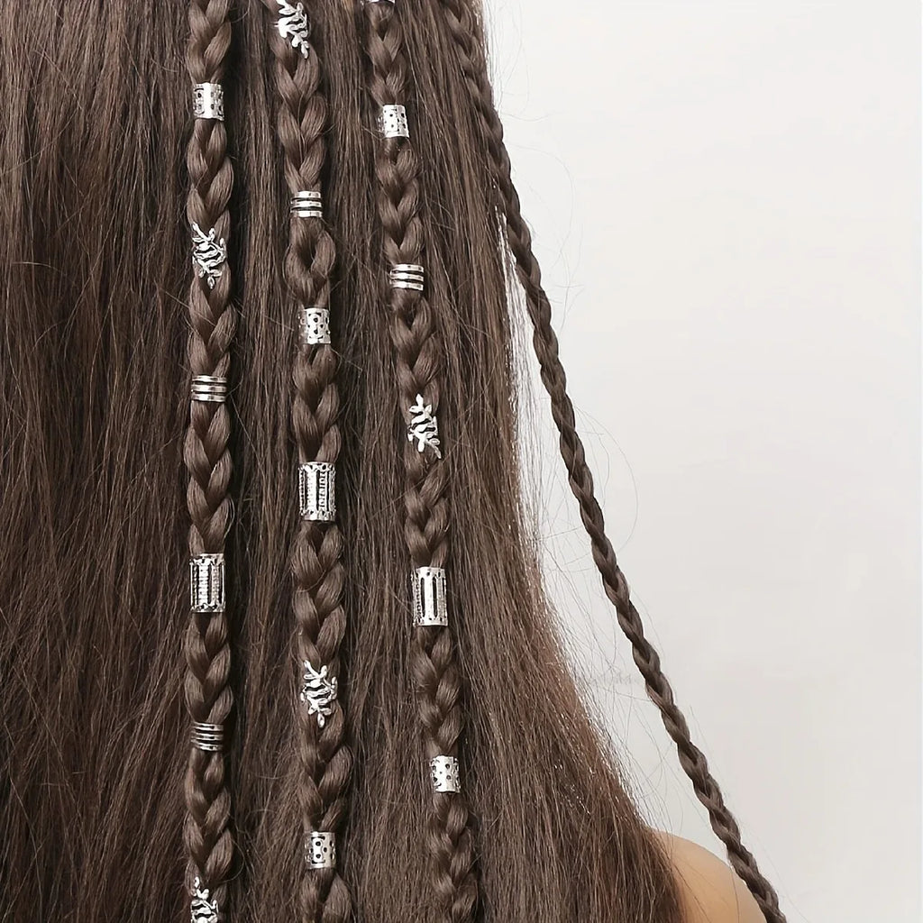 Close-up of braided hair with decorative beads on a white background