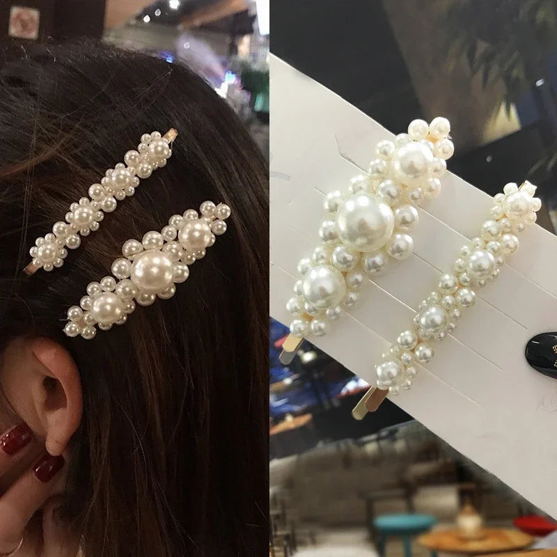 Pearl hair clip worn by a person and displayed on a stand.