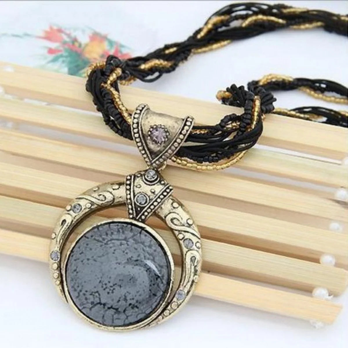 Vintage necklace with a decorative pendant on display