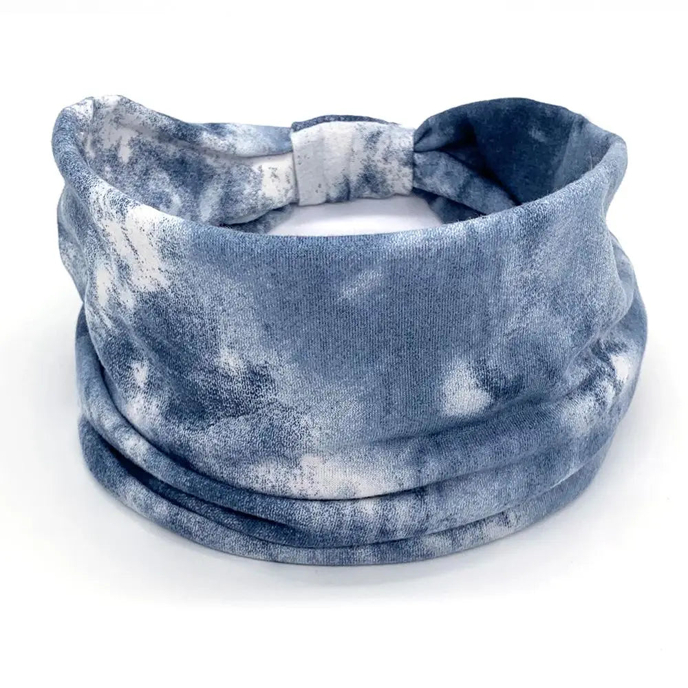 Blue and white tie-dye neck gaiter on a white background