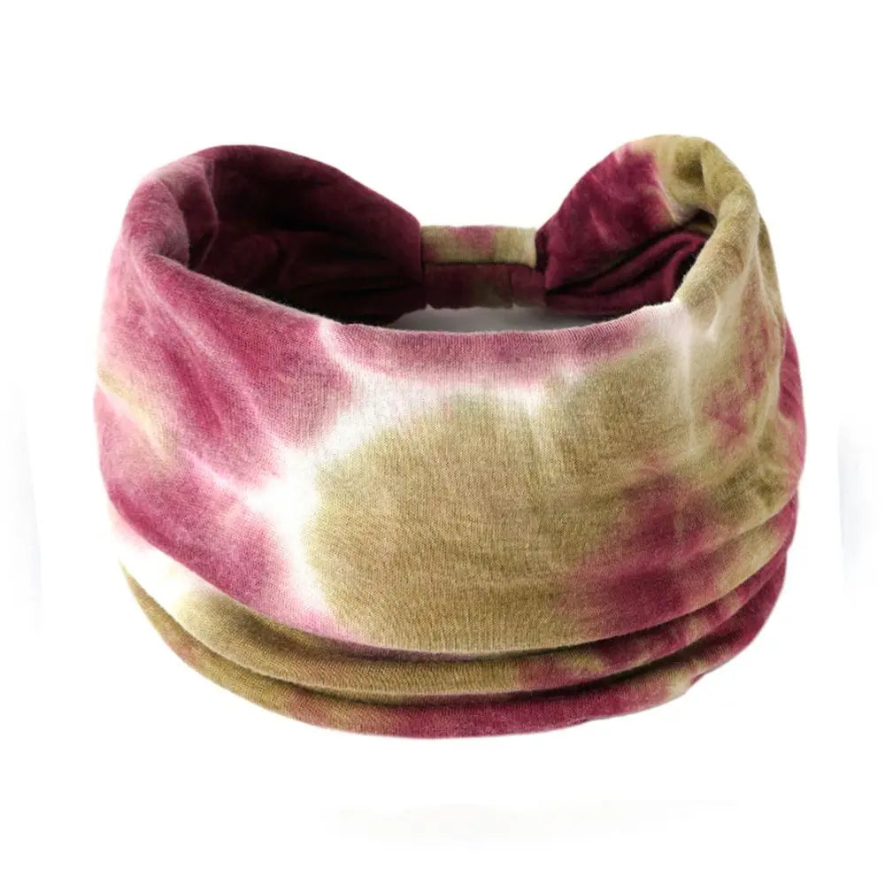 Tie-dye headband with pink and beige colors on a white background