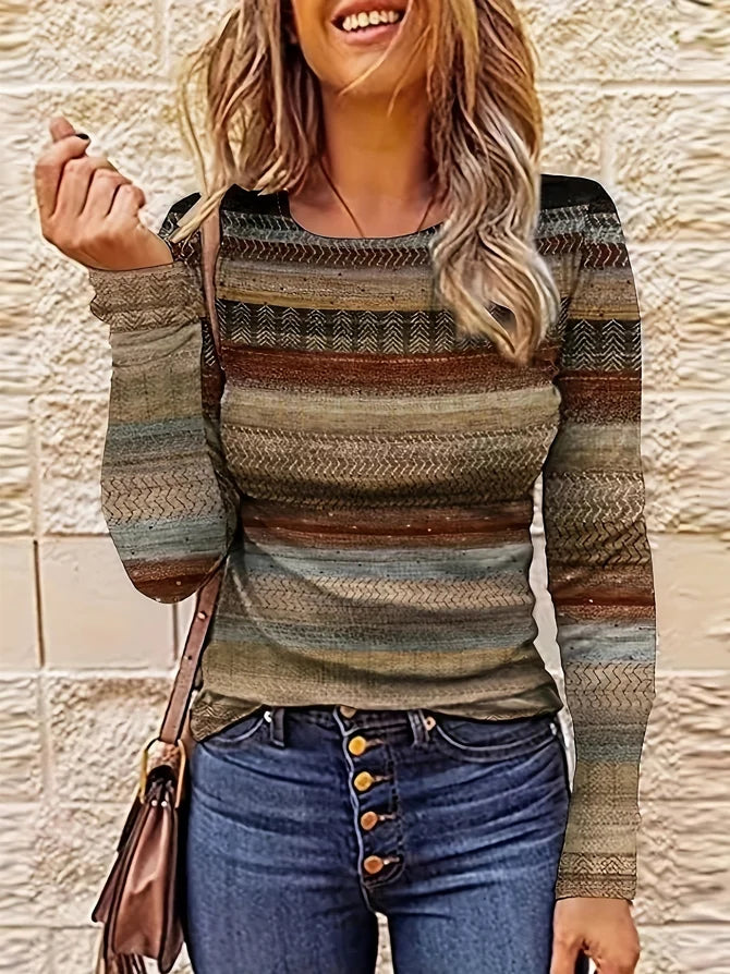 Person wearing a patterned sweater and jeans with a beige wall background
