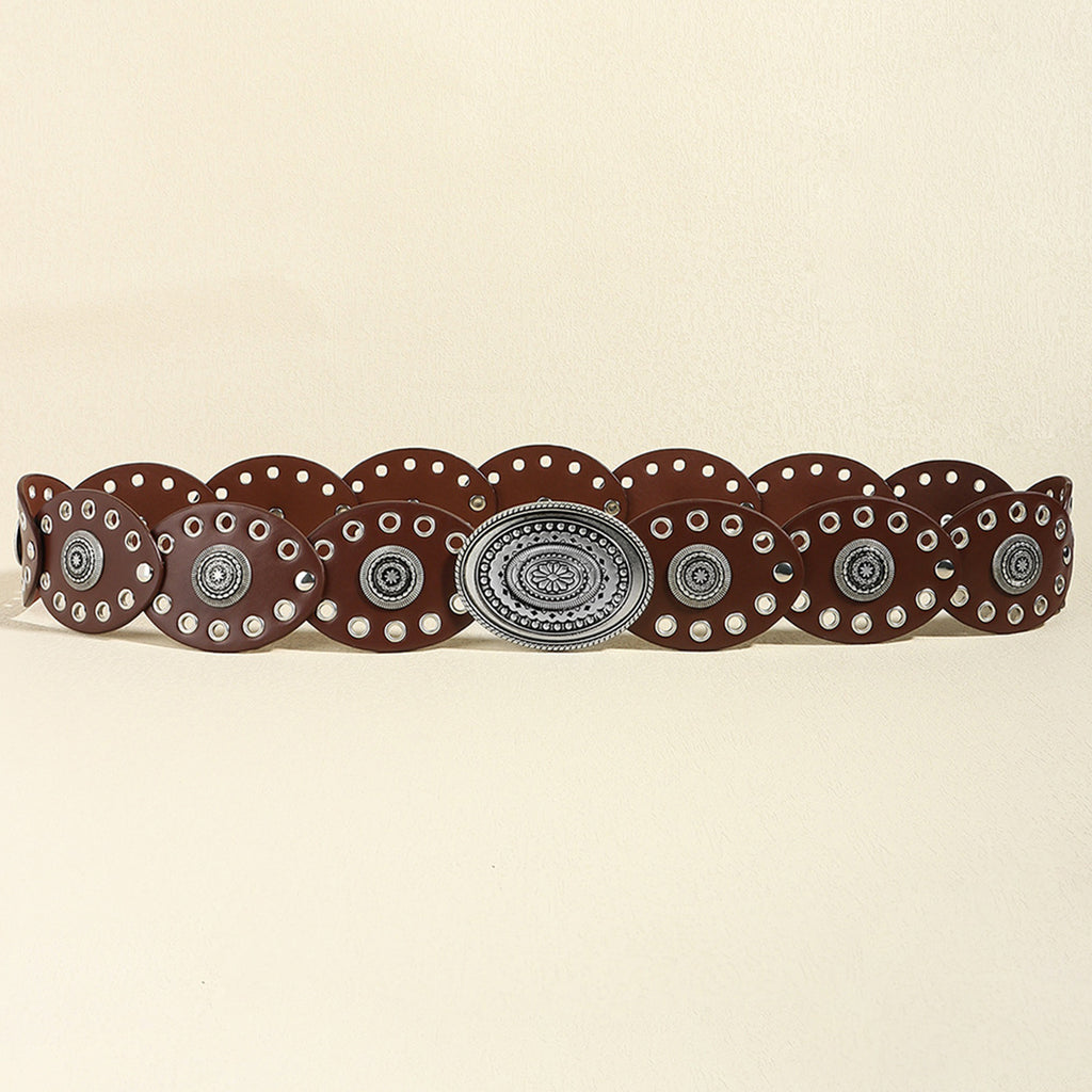 Brown belt with decorative silver buckle on a beige background