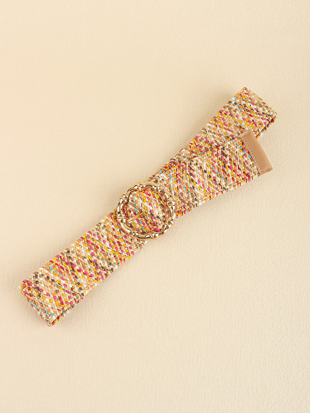 Multicolored woven belt with a gold buckle on a beige background