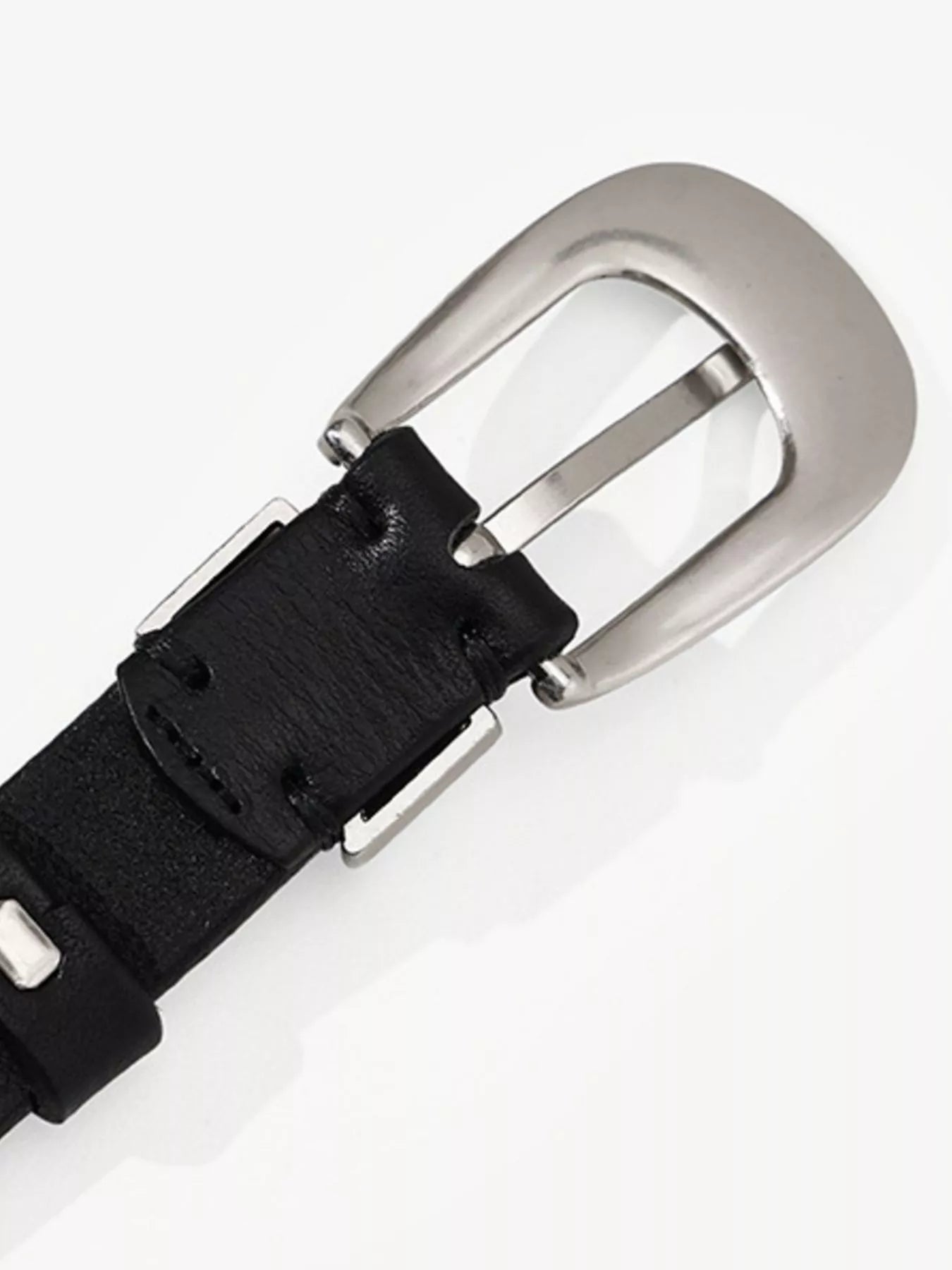Black belt with a silver buckle on a white background