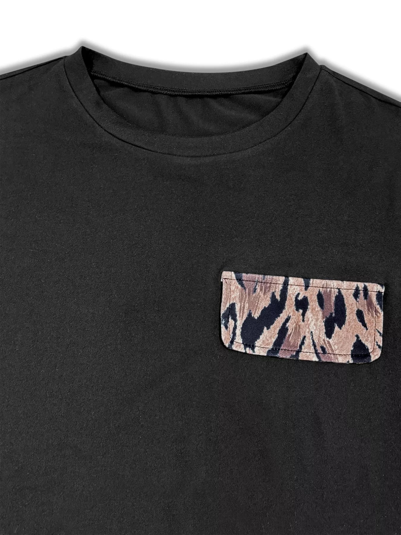 Black t-shirt with a camouflage pocket on a white background