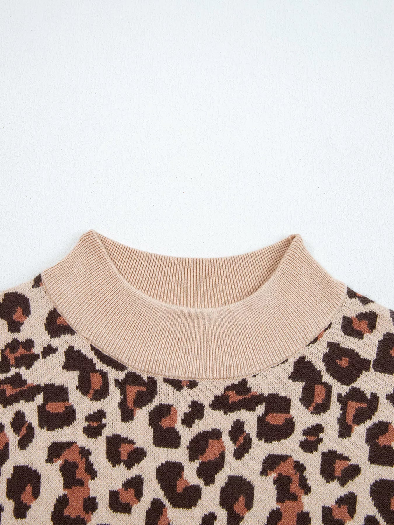 Leopard print pattern on a beige background