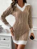 Beige cable knit sweater dress worn by a person in a home setting.