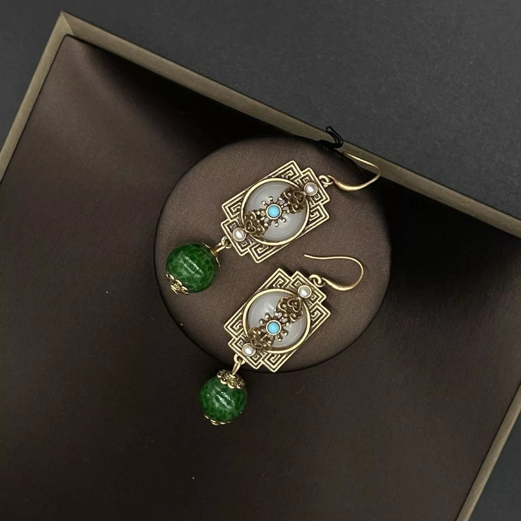 Image 3: Goddess Copper Dark Green Resin Dangle Earrings – angle view
