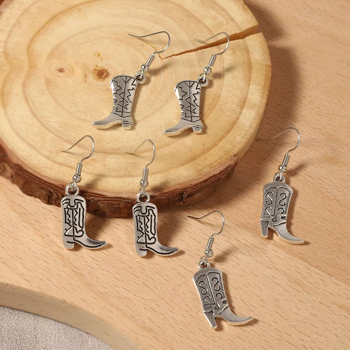 Goddess Copper Western Cowboy Boot Dangle Earrings – lifestyle flat lay
